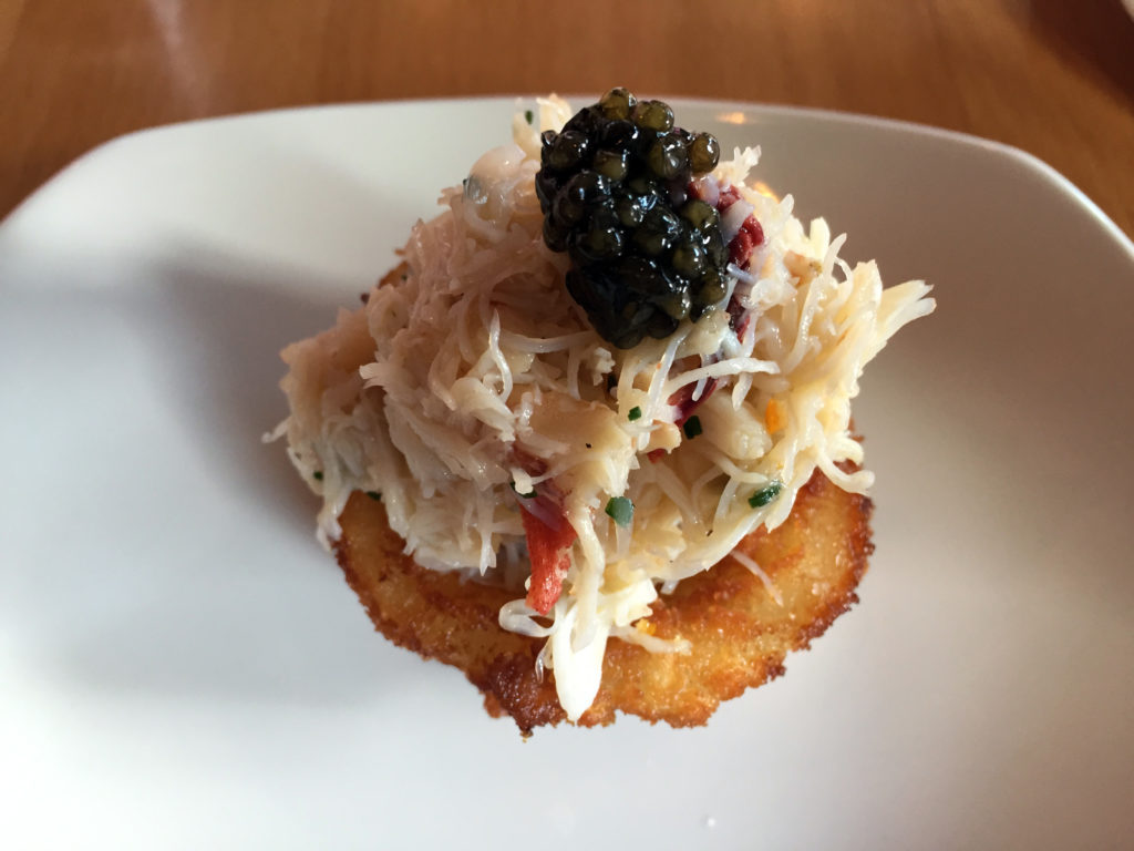 Dungeness crab on an onion ring