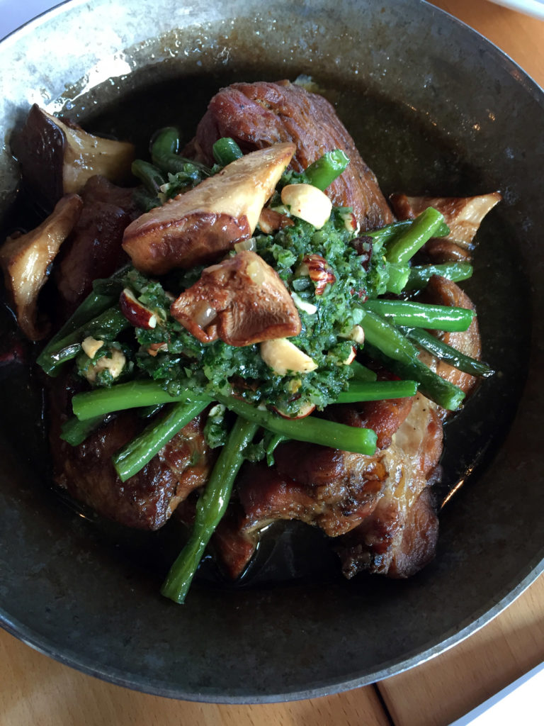 Pork shoulder confit with hazelnut chimichurri