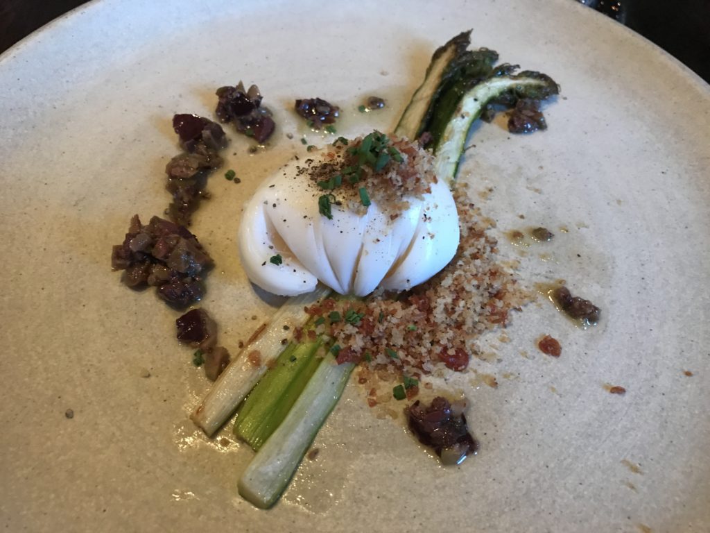 White asparagus with a poached duck egg, olives and a country ham crumble