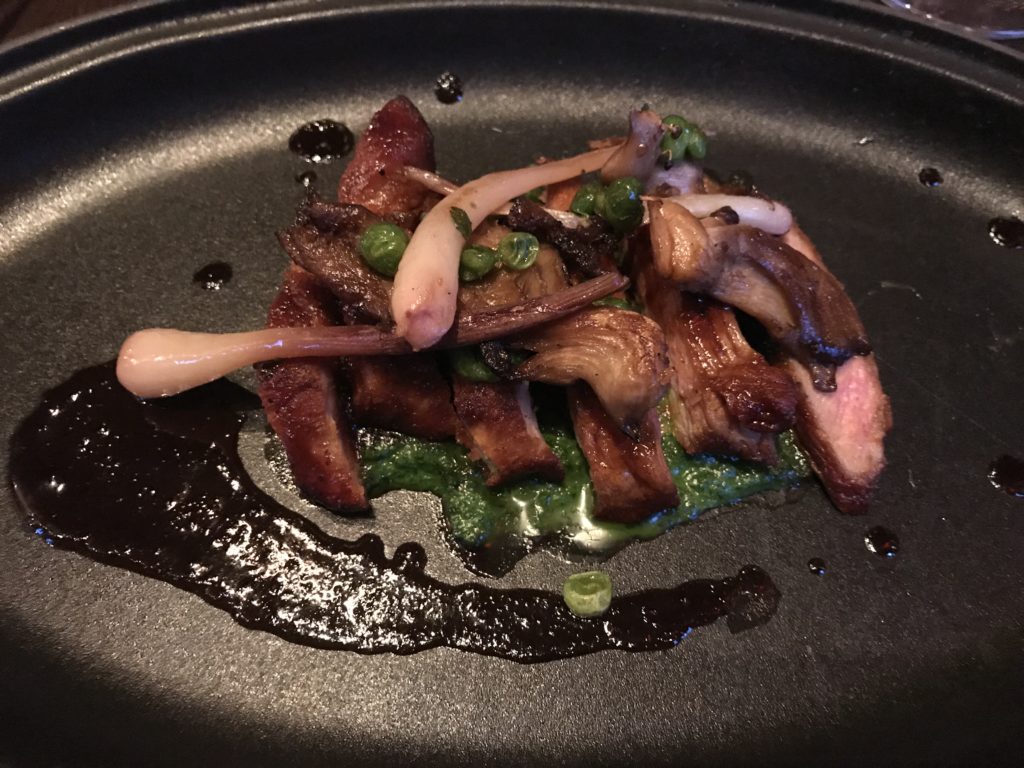 Niman Ranch pork with mustard greens, ramps and morel mushrooms