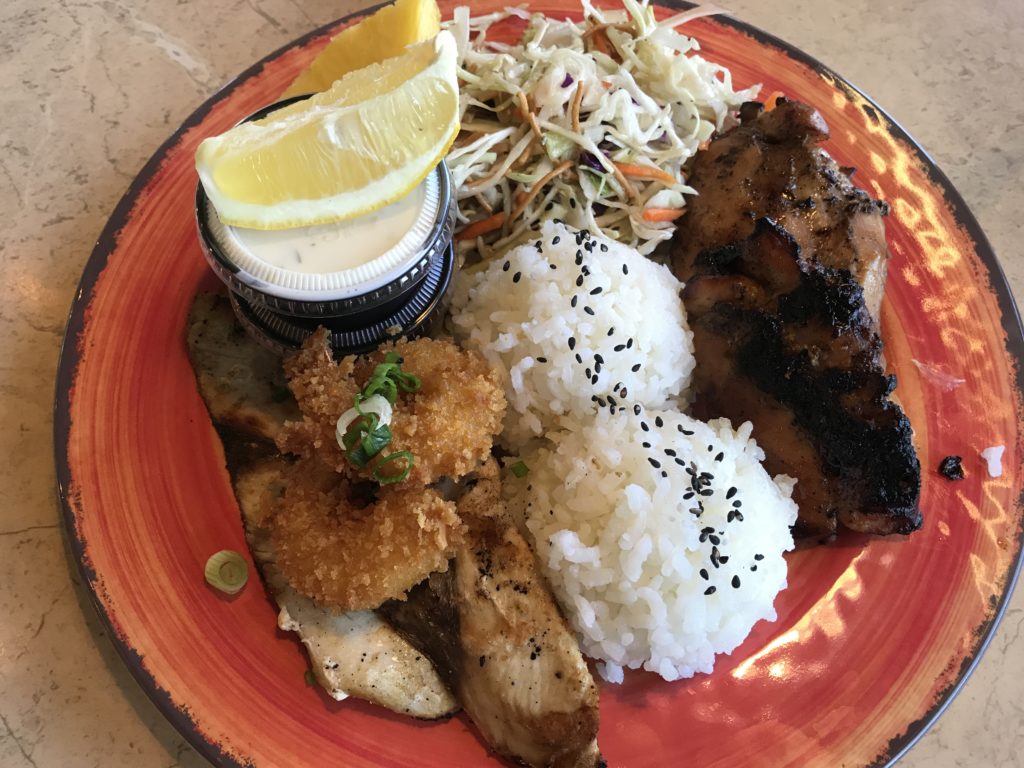 the Ohana plate—a grilled chicken breast marinated in a house-made teriyaki sauce served with fried shrimp and the fish of the day